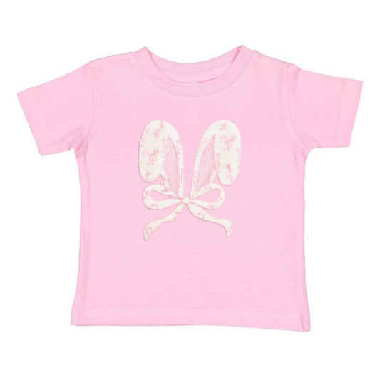 Pink t-shirt with white floral butterfly design on a white background