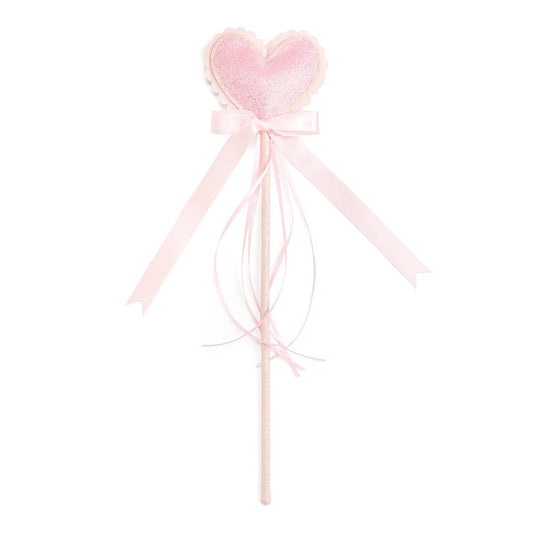 Pink heart-shaped wand with ribbons on a white background