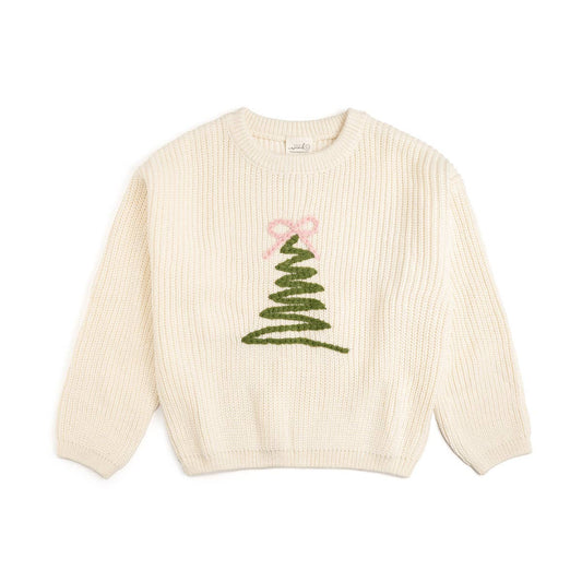 cream colored knit oversize sweating with a green embroidered christmas tree shaped zigzag in the middle of the sweater and a pink embroidered bow on the top of the christmas tree