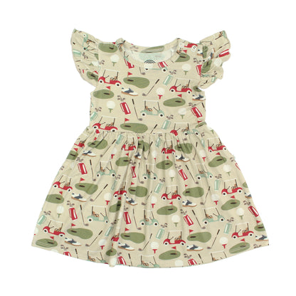 Children's dress with golf-themed pattern on a white background