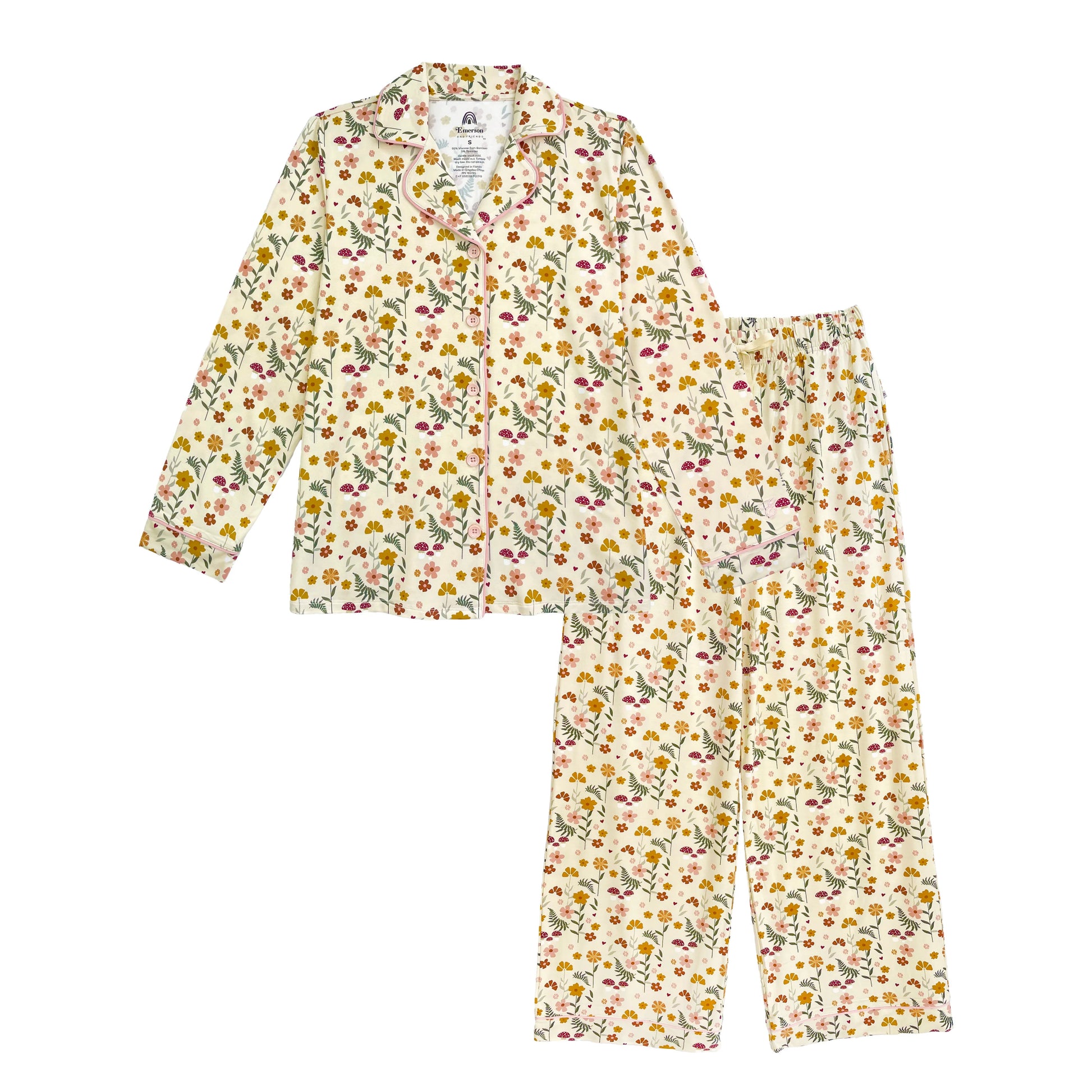 A two-piece pajama set consisting of a long-sleeve button-up shirt and matching pants, both featuring an all-over floral print on a cream background. The floral pattern includes yellow, pink, and green elements.