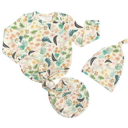 Newborn baby gift set featuring a bamboo tie-bottom gown and matching knotted hat in a vibrant Tropical Blooms floral print.