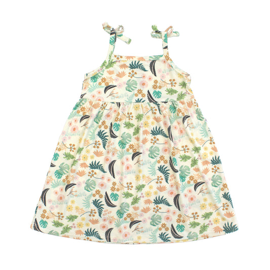 Girls bamboo sundress in the Tropical Blooms floral print featuring spaghetti straps with decorative bows and a flowy skirt.
