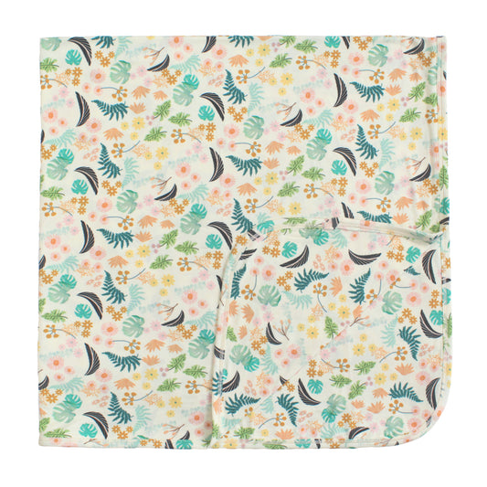 Large double-layered bamboo blanket in the Tropical Blooms print, featuring lush botanical leaves and vibrant florals.