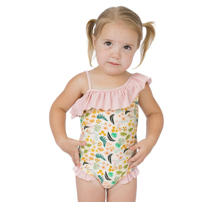 Girl wearing our Tropical Blooms one piece swimwear in a white background. 