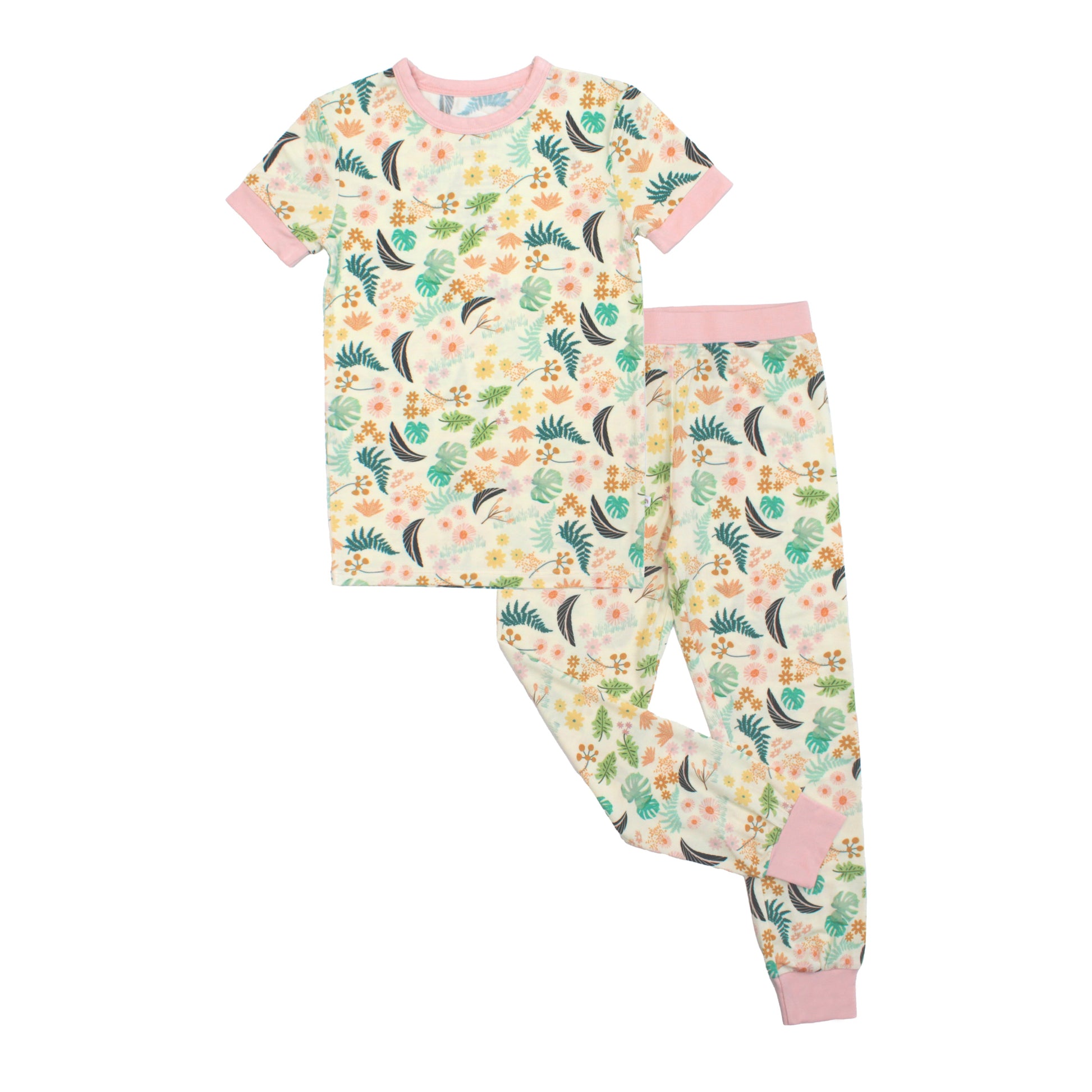 Two-piece kids bamboo pajama set with short sleeve top and long pants in a vibrant Tropical Blooms floral print.