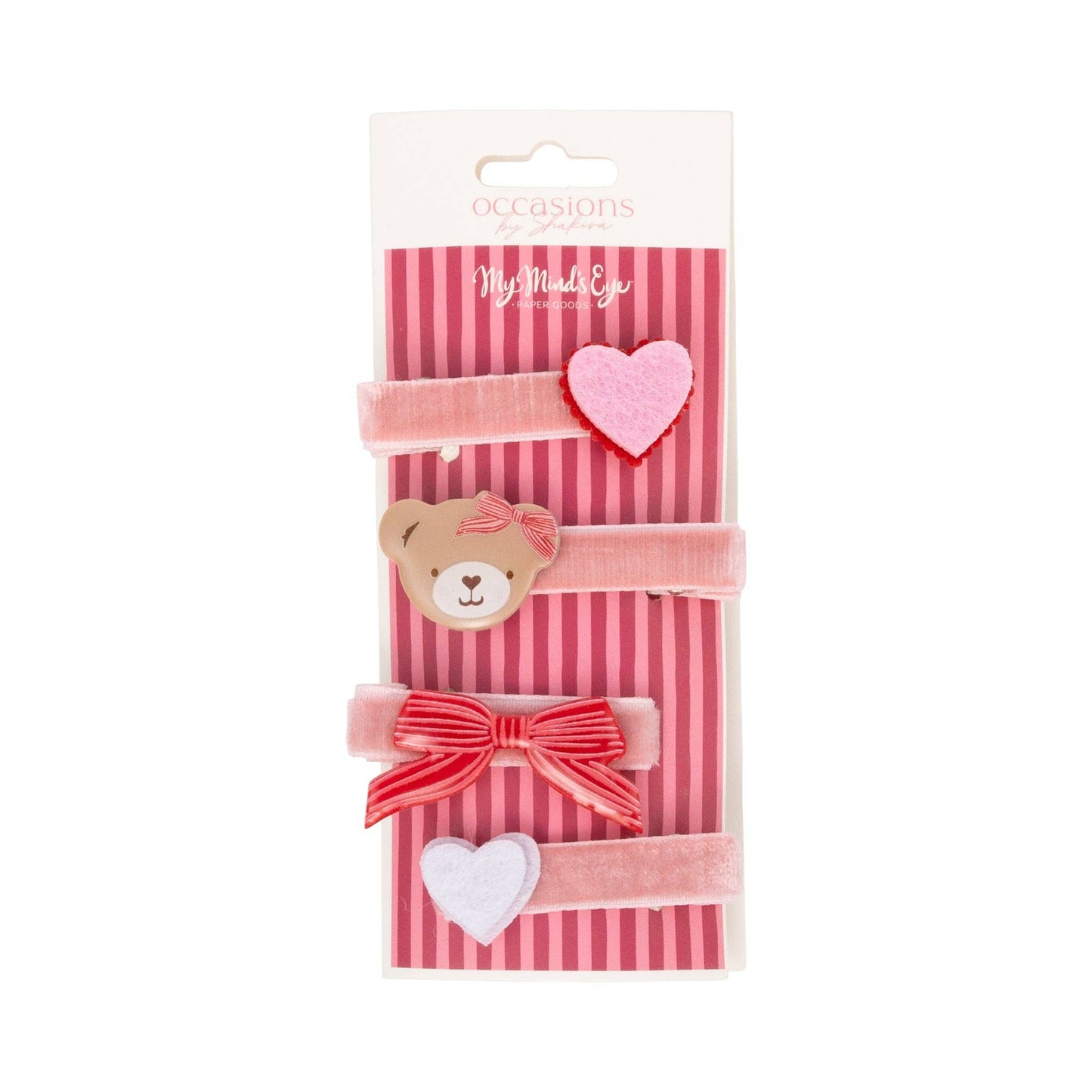 Packaged hair accessories with a teddy bear, heart, and bow design on a striped background.