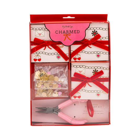 Makeup charm kit with tools and packaging on a white background
