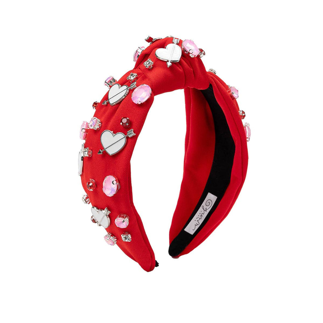 red headband with valentines themed gemstones on it