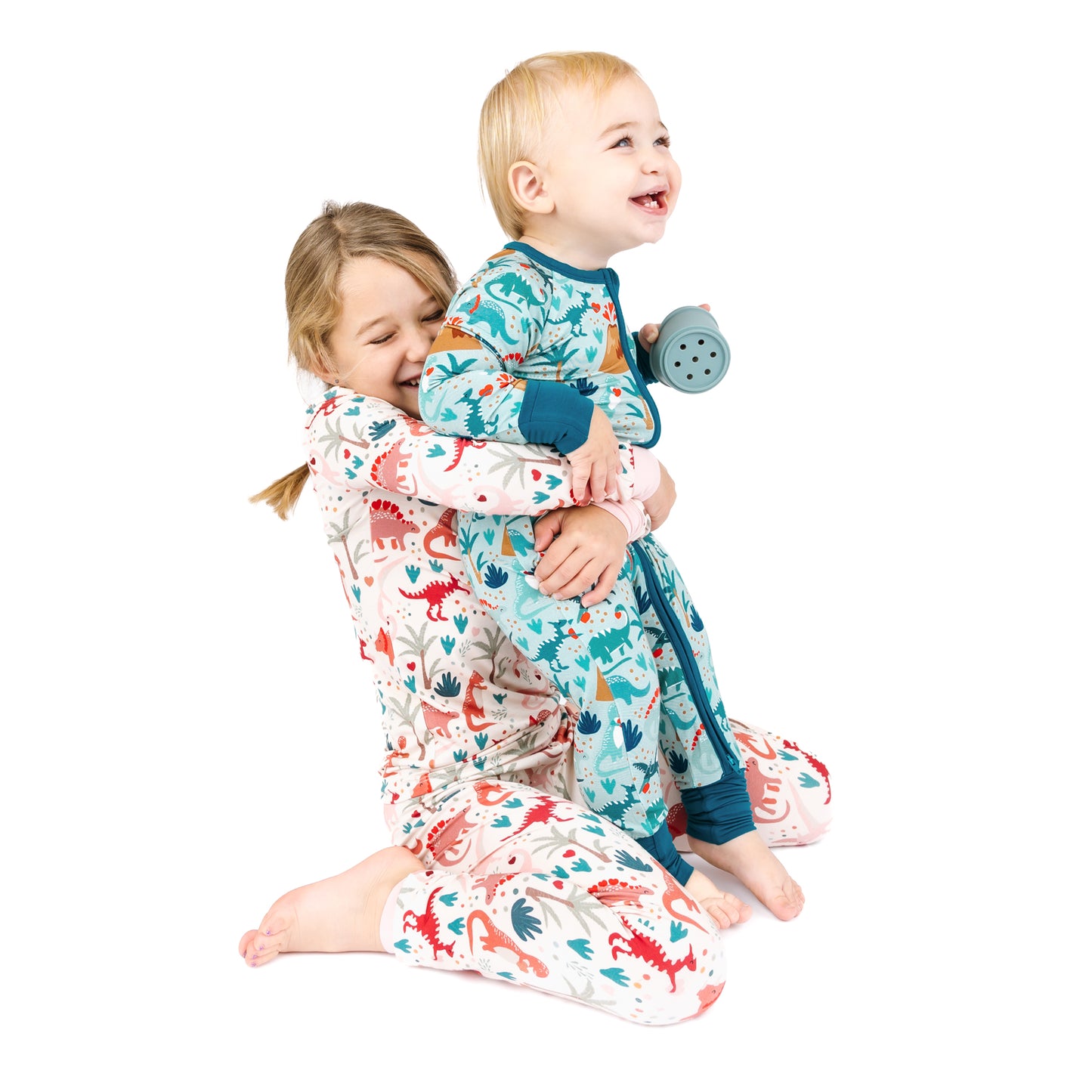 Sibling matching bamboo pajamas in volcano dinosaur print
