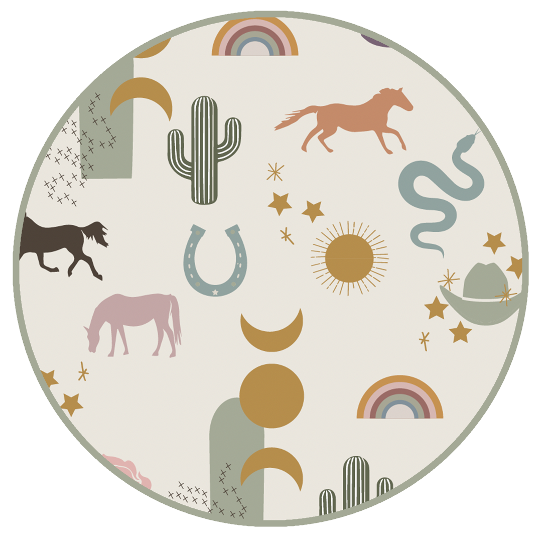 the "wild and free" print is a mix of colorful horses, snakes, cowboy hats, cacti, suns, stars, moons, and rainbows, all on a white background. this is a boho cowboy design. 