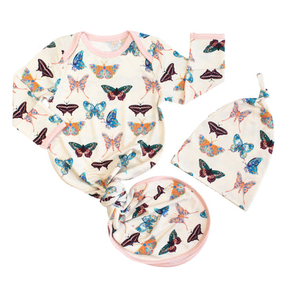 Newborn baby gift set featuring a bamboo gown and matching knotted hat in a colorful butterfly print.