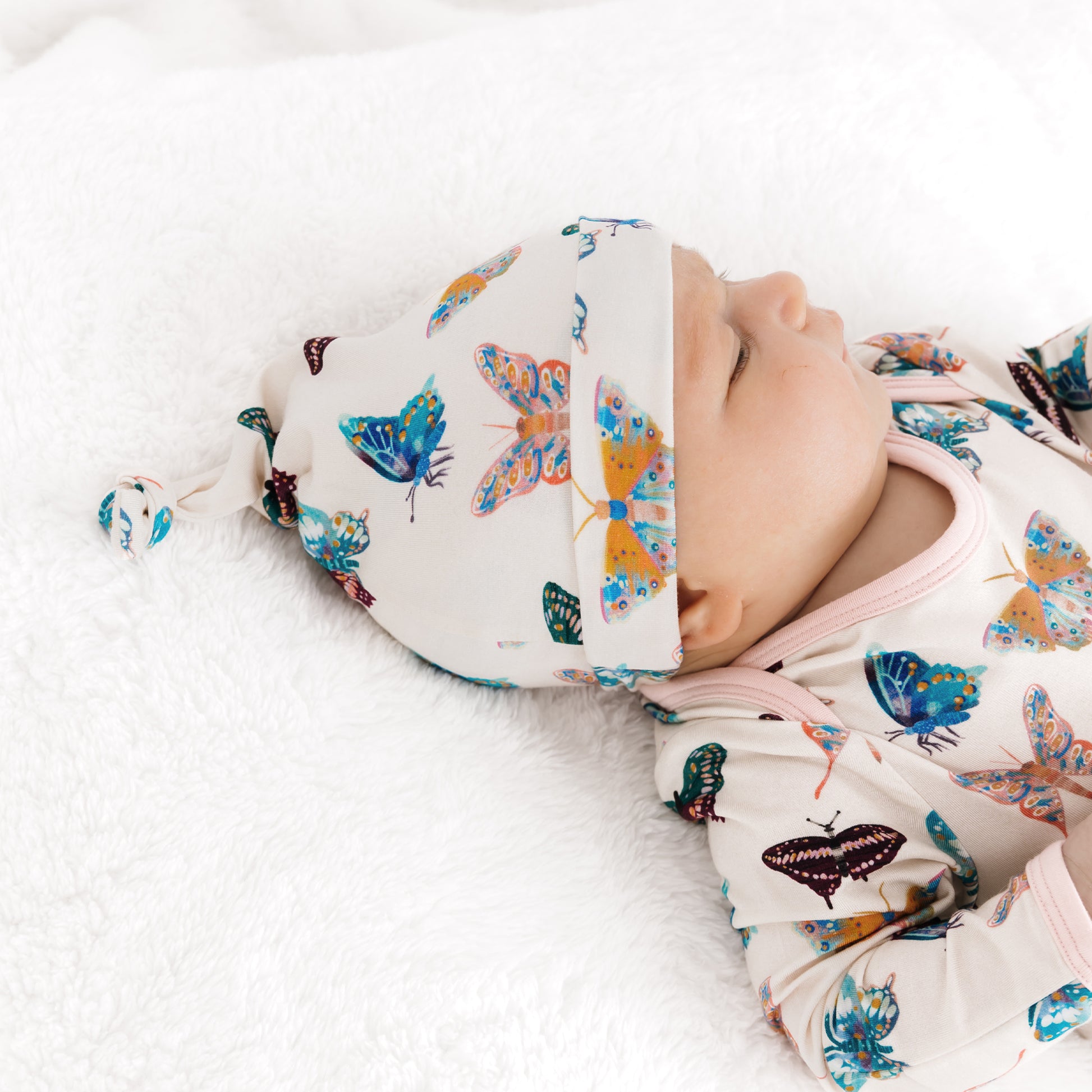 Close-up of the vibrant and cheerful butterfly pattern fluttering on a soft cream background.