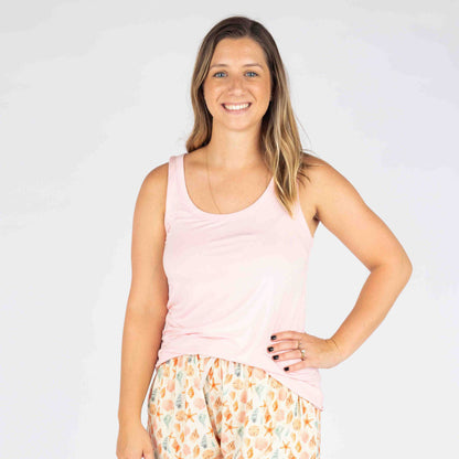 Woman posing with our bubblegum tank top and our sandy shell bamboo pajama shorts. 