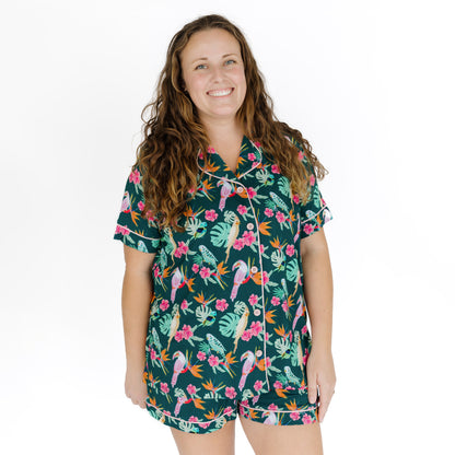 A woman wearing the Isla Botánica bamboo shorts set, showcasing the relaxed fit and classic collar.