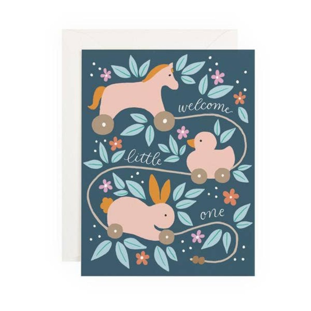 card says "welcome little one" with little wooden animals