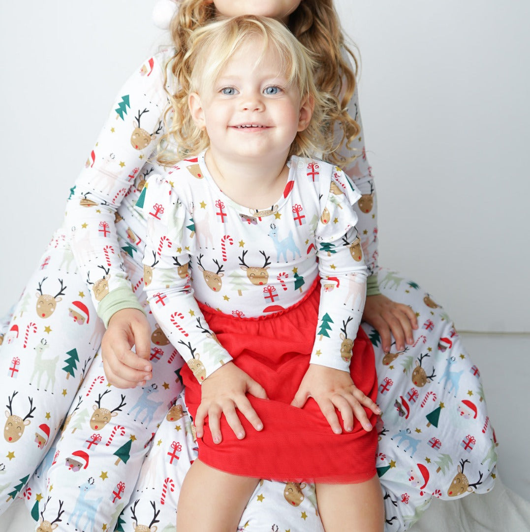 Girl sitting in Christmas Dress