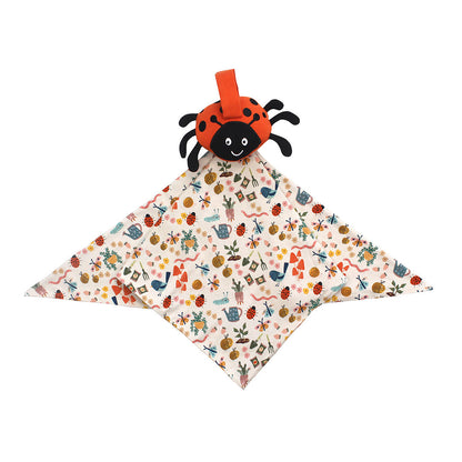 Flat lay ladybug lovey on a white background. 
