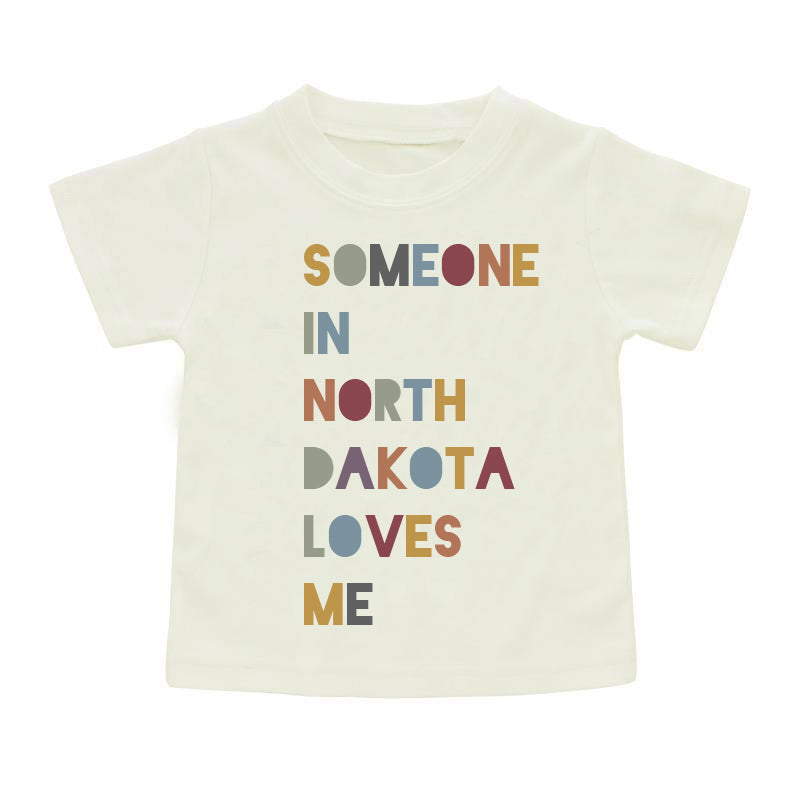 Someone in North Dakota Cotton Toddler Short Sleeve Shirt