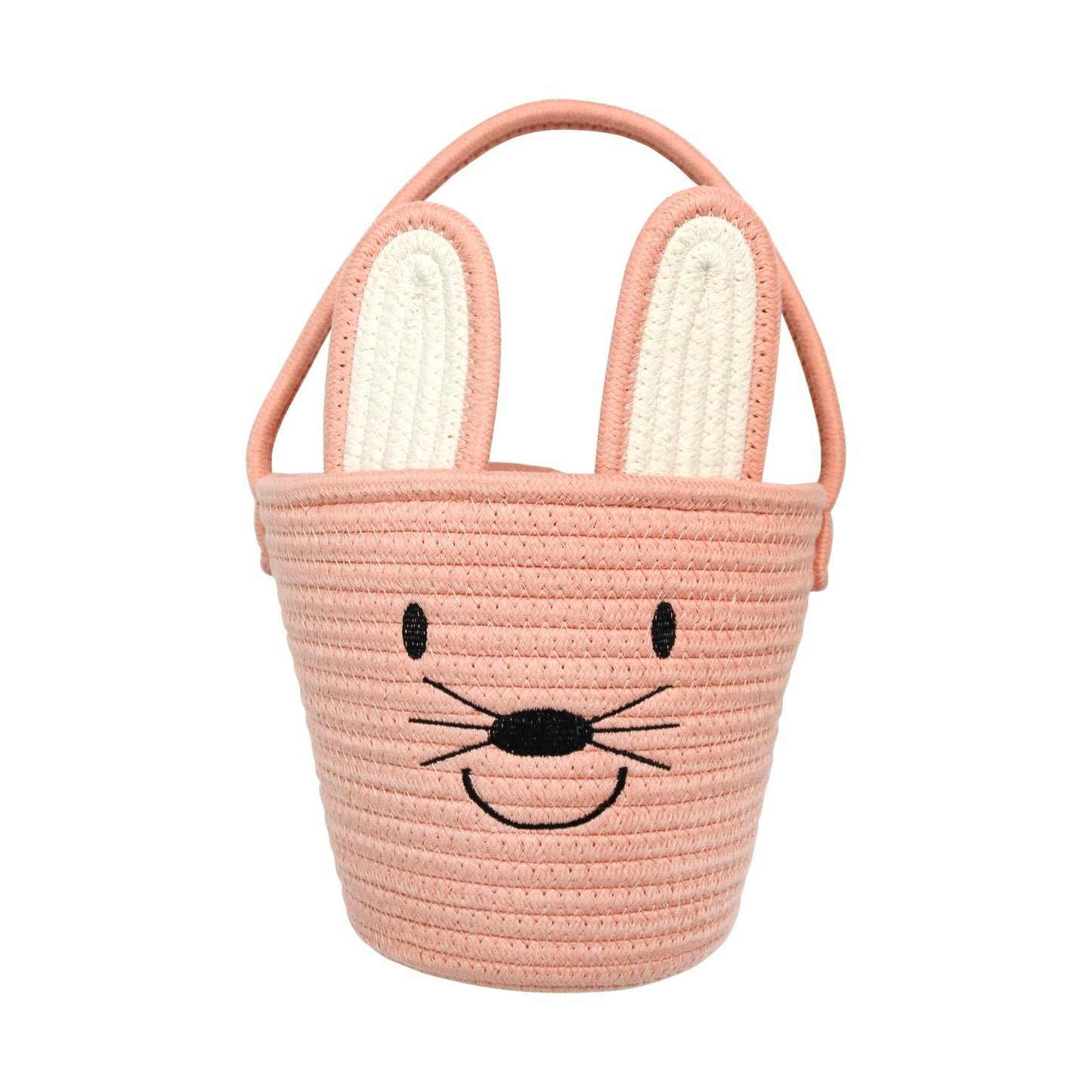 Flat lay pink bunny basket on a white background. The Bunny ears emerge from the basket and the front has a smiley face. 