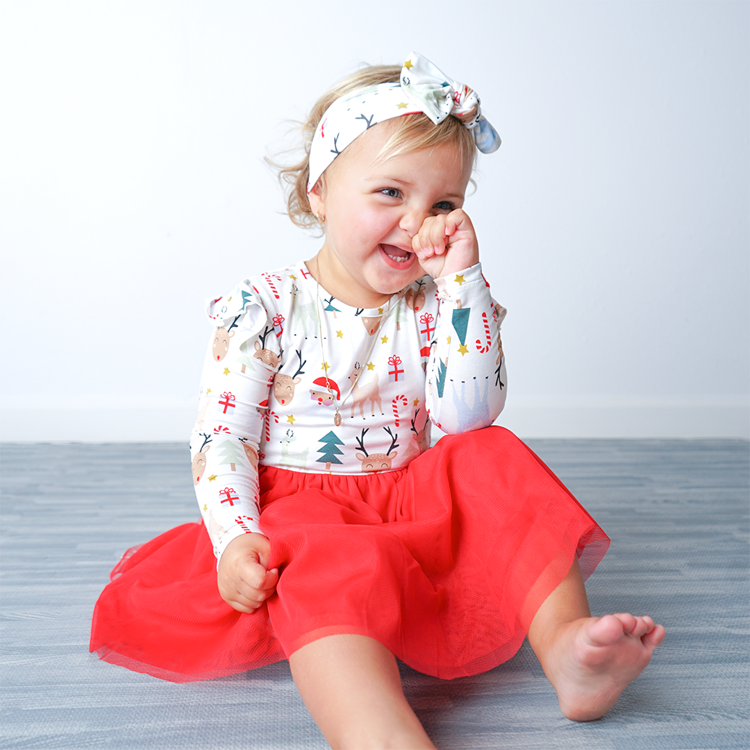 Girl sitting in christmas bamboo dress