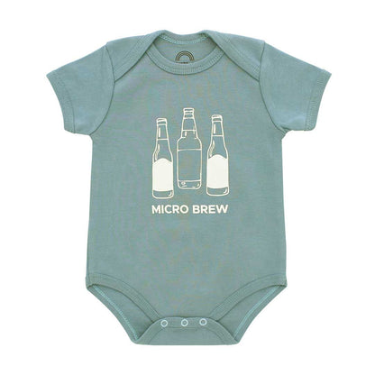 A short-sleeve baby bodysuit in dusty sage green with a white graphic of three beer bottles and the text 'MICRO BREW' printed on the chest, displayed flat against a white background.